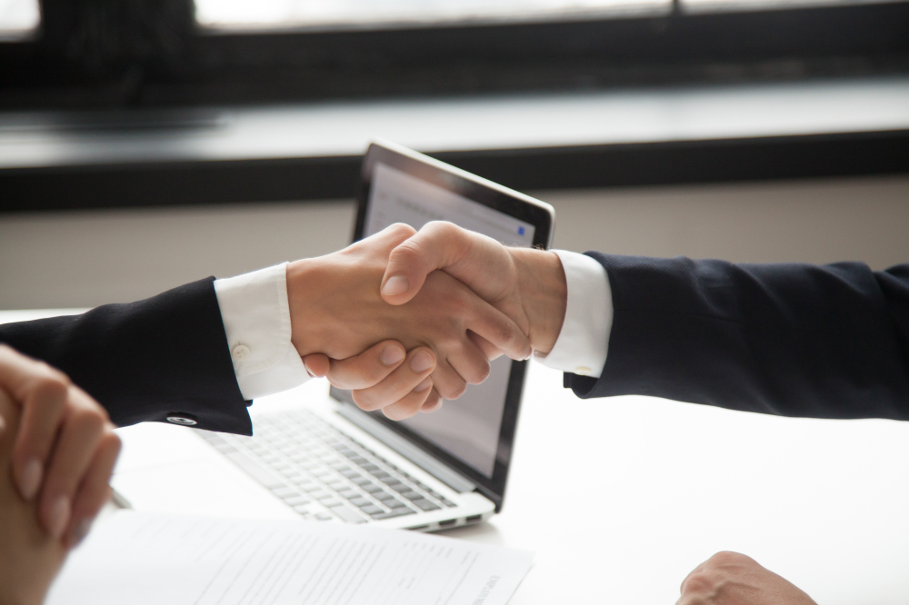 businessman handshaking businesswoman showing respect, closeup v