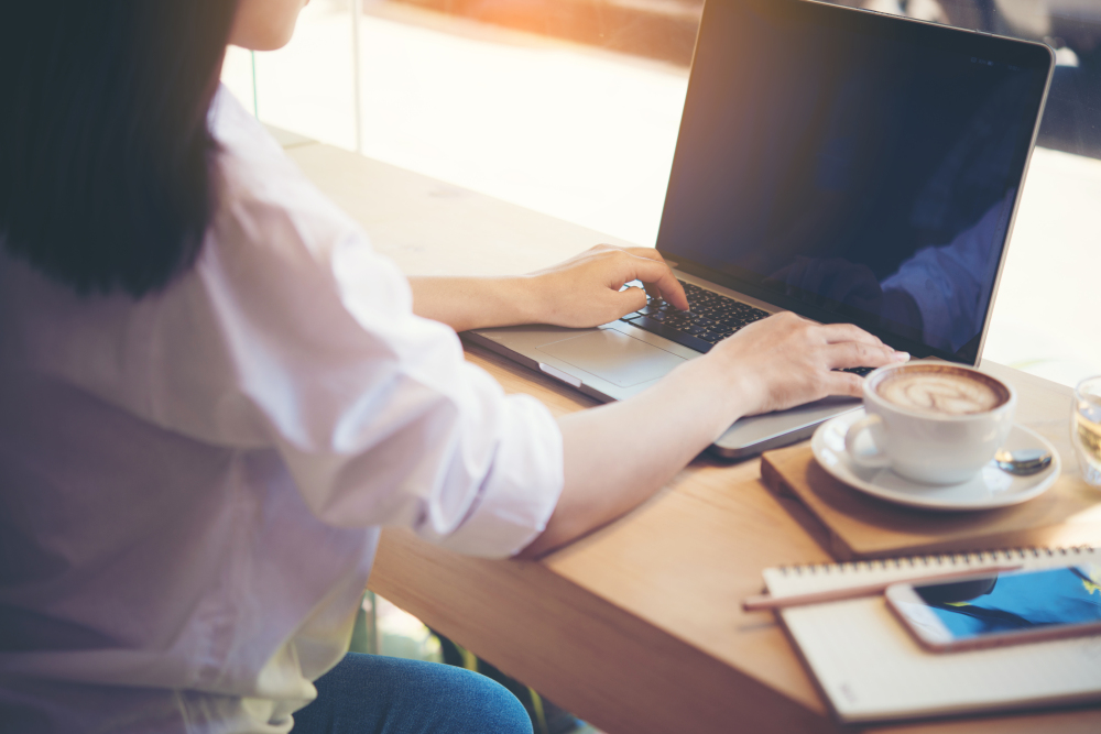 young woman using laptop computer. female working on laptop in c